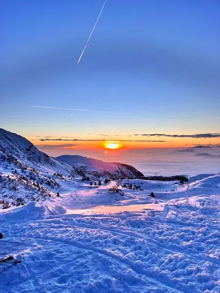 Escursione in motoslitta al tramonto con aperitivo a Montecampione