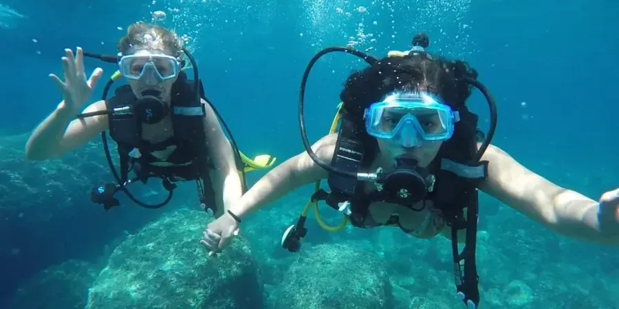 Battesimo del mare nella riserva naturale dell'Isola Bella a Taormina