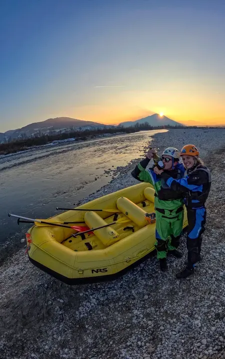 Sunset rafting on the Piave River with toast in the Belluno Dolomites