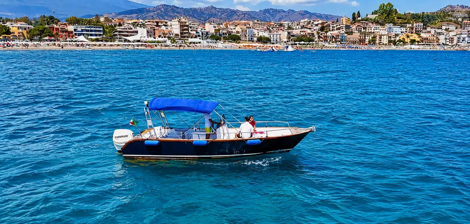 Taormina coast tour with skipper and aperitif on board from Giardini Naxos