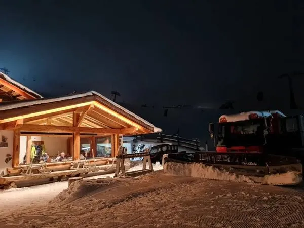 Dinner in a Mountain Hut with Snowmobile transport in Canazei